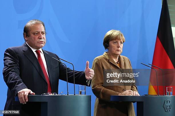 Germany's Chancellor Angela Merkel and Pakistan's Prime Minister Nawaz Sharif hold a joint press release after their meeting at the Prime Ministry...