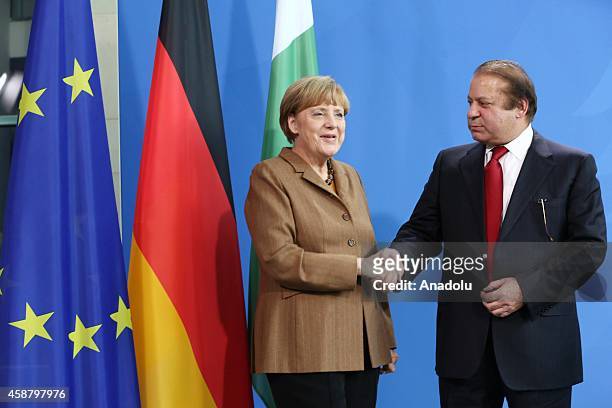 Germany's Chancellor Angela Merkel and Pakistan's Prime Minister Nawaz Sharif hold a joint press release after their meeting at the Prime Ministry...