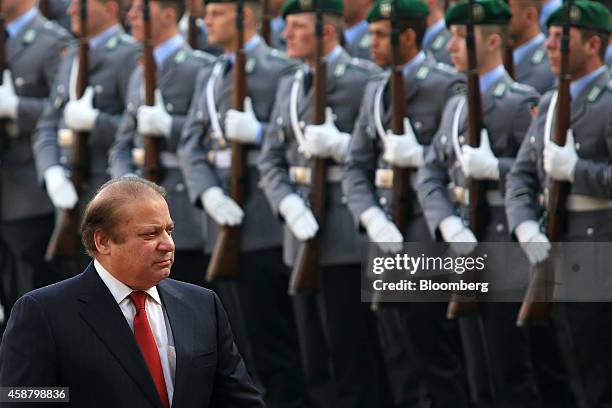 Nawaz Sharif, Pakistan's prime minister, reviews an honor guard ahead of a news conference at the Chancellery in Berlin, Germany, on Tuesday, Nov....