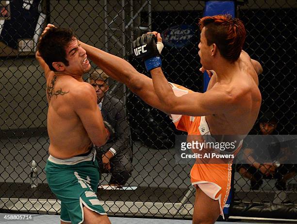 Team Werdum fighter Leonardo Morales kicks team Velasquez fighter Gabriel Benitez in their semifinal fight during filming of The Ultimate Fighter...