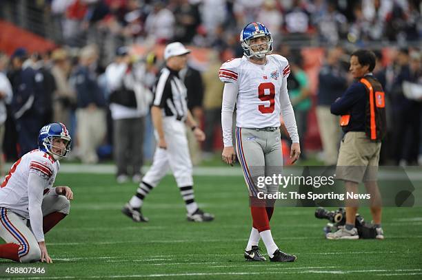 Jeff Feagles and Lawrence Tynes of the New York Giants participate in warm-ups before Super Bowl XLII against the New England Patriots on February 3,...