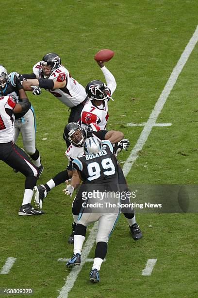 Brentson Buckner of the Carolina Panthers rushes the pass against Michael Vick of the Atlanta Falcons on December 4, 2005 at the Bank of America...