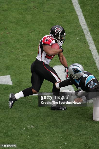 Allen Rossum of the Atlanta Falcons gets tackled during a game against the Carolina Panthers on December 4, 2005 at the Bank of America Stadium in...