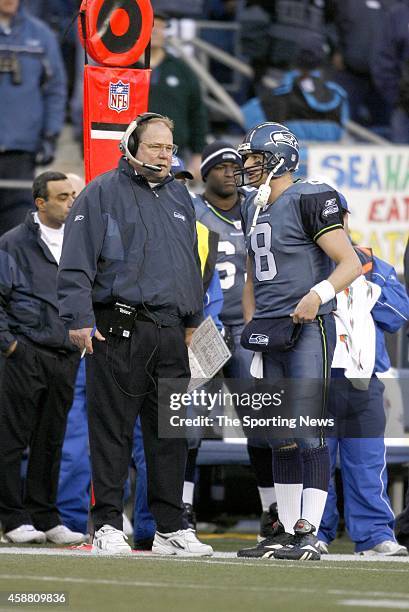 Head Coach Mike Holmgren and Matt Hasselbeck of the Seattle Seahawks gives look on from the sideline during a game against the Carolina Panthers on...