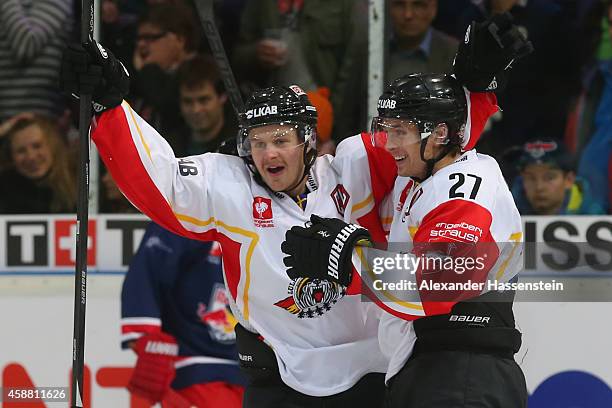 Daniel Zaar of Lulea celebrates scoring the 6th team goal with his team mate Lucas Wallmark during the Champions Hockey League Play-Off Round of 16...