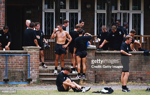 Vinnie Jones and Wimbledon team mates take a break after a pre season training session on July 27, 1995 in Wimbledon, England.