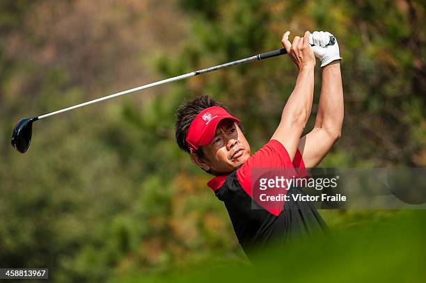 Hiroyuki Fujita of Japan tees off on the 10th tee during the Royal Trophy Europe vs Asia Golf Championship at Dragon Lake Golf Club on December 22,...