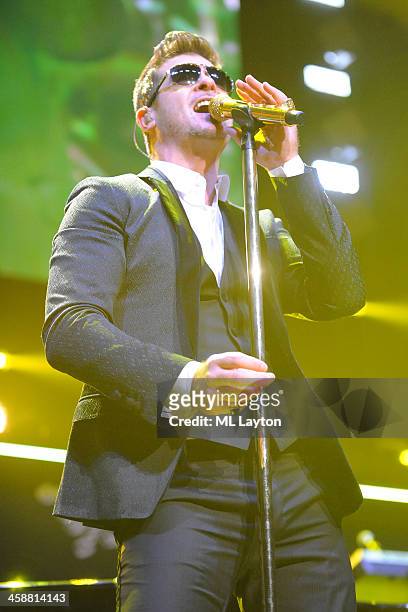 Robin Thicke performs at Hot 99.5's Jingle Ball 2013 at Verizon Center on December 16, 2013 in Washington, DC.