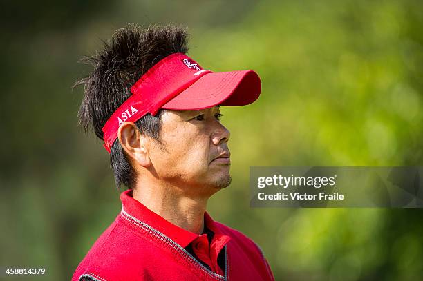 Hiroyuki Fujita of Japan looks on during the single's matches in the Royal Trophy Europe vs Asia Golf Championship at Dragon Lake Golf Club on...