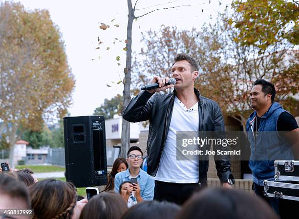 Tv personality Ryan Seacrest and MC Manny On The Streets onstage during the Ford Drive 4UR School Event with Ryan Seacrest, The Recording Academy and...