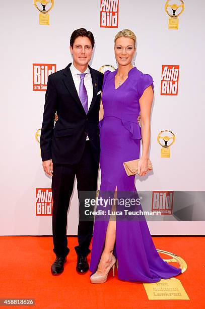 Marcus Hoefl and Maria Hoefl - Riesch attend 'Goldenes Lenkrad' Award 2014 at Axel Springer Haus on November 11, 2014 in Berlin, Germany.