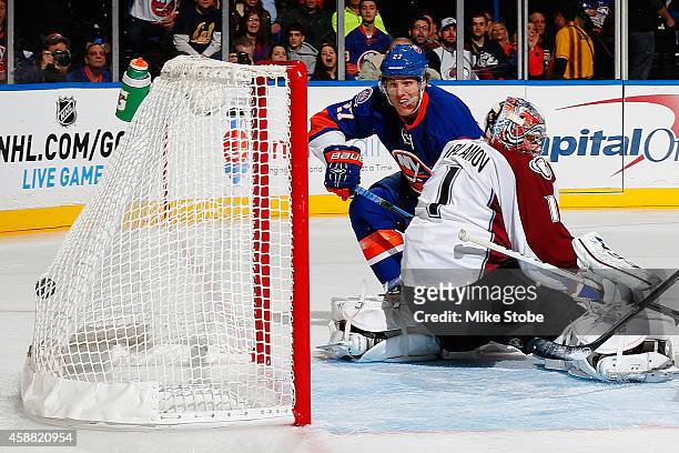 Anders Lee of the New York Islanders scores a first-period goal against Semyon Varlamov of the Colorado Avalanche at Nassau Veterans Memorial...
