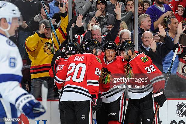 Brandon Saad, Marian Hossa and Michal Rozsival of the Blackhawks celebrate after scoring against the Tampa Bay Lightning in the second period of the...