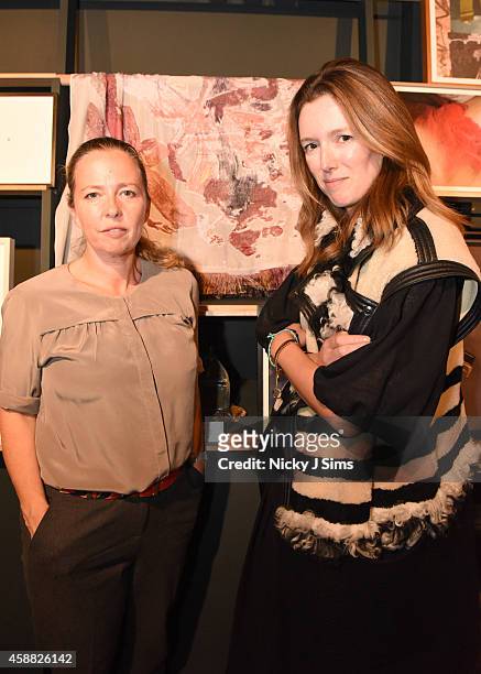 Jenny Saville and Clare Waight Keller appear with the scarf they created together for Chloe at House of Voltaire opening in Mayfair supported by...