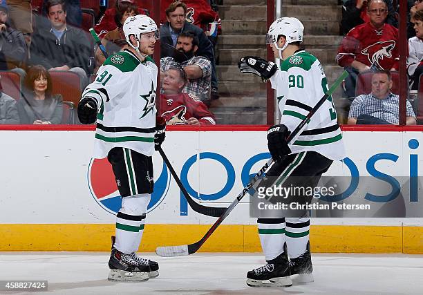 Tyler Seguin and Jason Spezza of the Dallas Stars celebrate after Seguin scored a second period goal against the Arizona Coyotes during the NHL game...