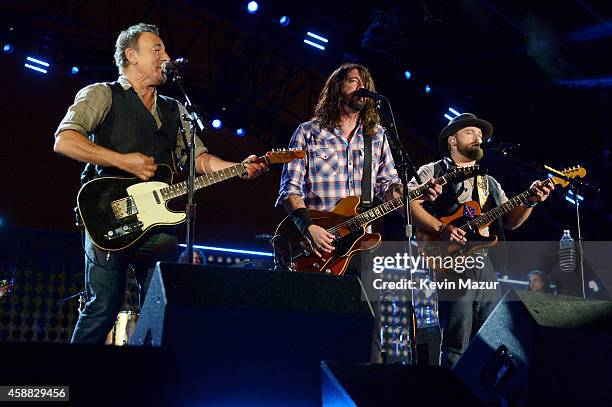 Musicians Bruce Springsteen, Dave Grohl and Zac Brown perform onstage during "The Concert For Valor" at The National Mall on November 11, 2014 in...