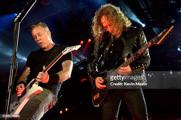 Musicians James Hetfield and Kirk Hammett of Metallica perform onstage during "The Concert For Valor" at The National Mall on November 11, 2014 in...