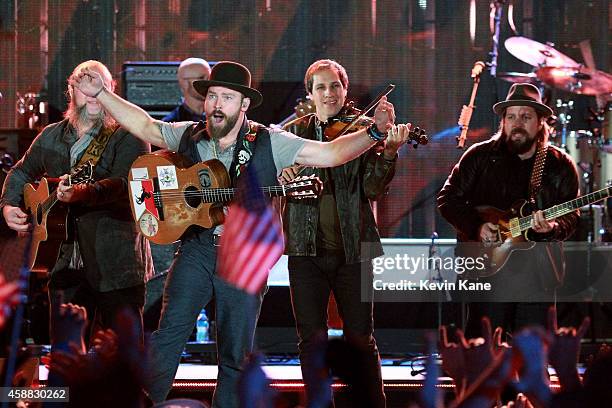 Musicians John Driskell Hopkins, Zac Brown, Jimmy De Martini and Coy Bowles of Zac Brown Band perform onstage during "The Concert For Valor" at The...