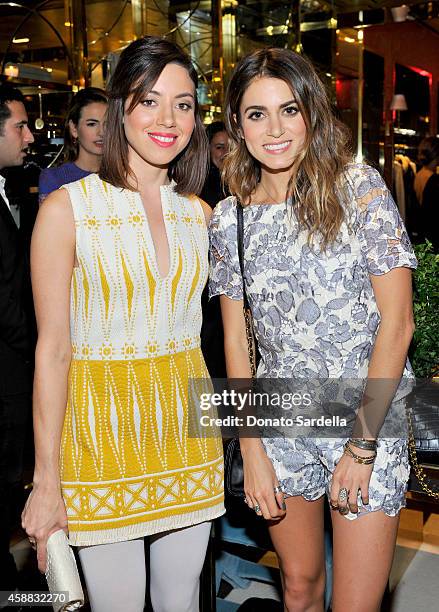 Actresses Aubrey Plaza and Nikki Reed attend Vogue and Tory Burch celebrate the Tory Burch Watch Collection at Tory Burch on November 11, 2014 in...