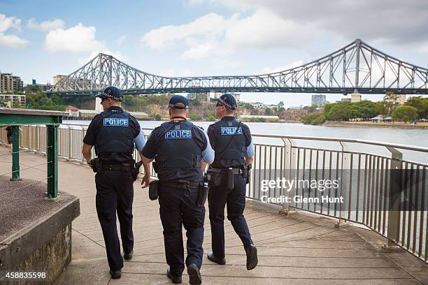 Police walk along the water front ahead of the G20 Leaders Summit on November 12, 2014 in Brisbane, Australia. Police patrol along the Brisbane River...