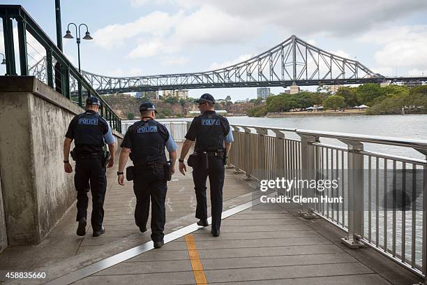 Police walk along the water front ahead of the G20 Leaders Summit on November 12, 2014 in Brisbane, Australia. Police patrol along the Brisbane River...