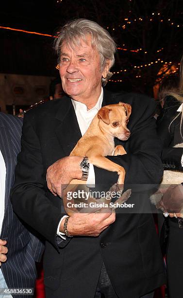 Alain Delon with dog during the Opening of the Gut Aiderbichl Christmas Market on November 11, 2014 in Henndorf am Wallersee, Austria.