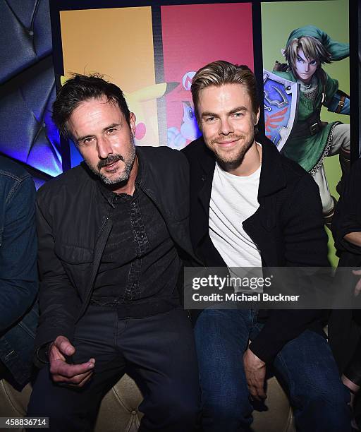 Actors David Arquette and actor Derek Hough enjoy the festivities during the Super Smash Bros for Wii U event on November 11, 2014 in Los Angeles,...