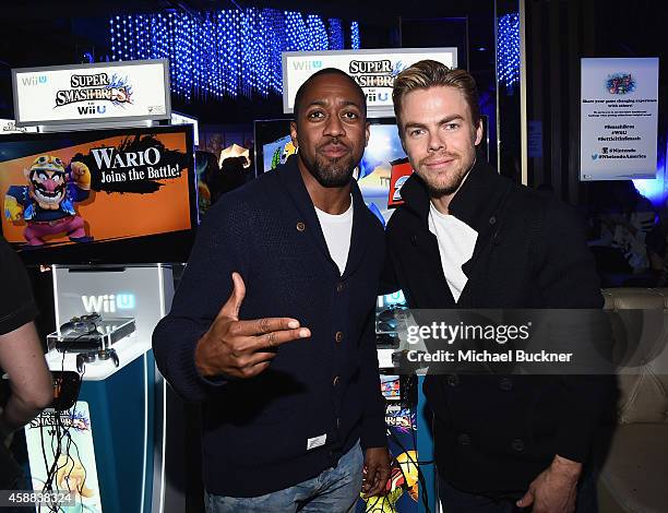 Actor Jaleel White and actor Derek Hough enjoy the festivities during the Super Smash Bros for Wii U event in West Hollywood, CA on November 11, 2014...