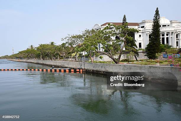 Houses stand along a canal in the upmarket Pantai Indah Kapuk area of North Jakarta, Indonesia, on Wednesday, Nov. 5, 2014. Jakarta, a former Dutch...