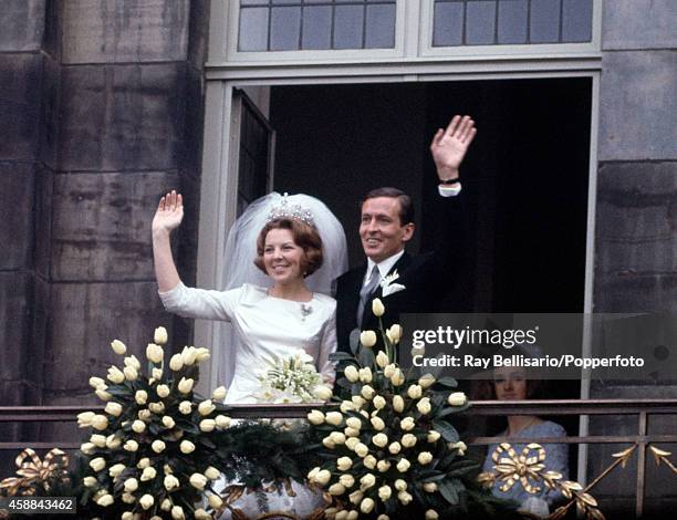 Newlyweds Princess Beatrix and Claus van Amsberg waving from the balcony of Dam Palace in Amsterdam following their wedding on 10th March 1966.