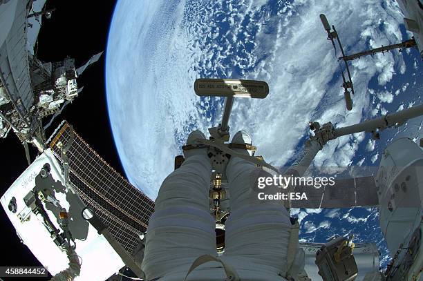 In this handout photo provided by the European Space Agency , German ESA astronaut Alexander Gerst takes a photo during his spacewalk, whilst aboard...