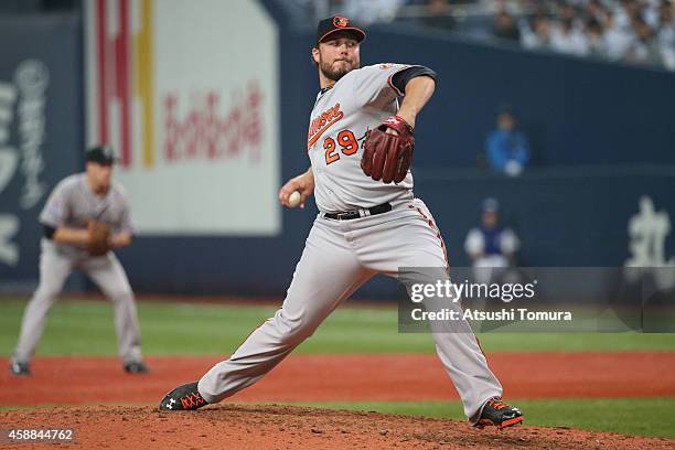 Tommy Hunter of the Baltimore Orioles pitches against Samurai Japan in the sixth inning during the Game one of Samurai Japan and MLB All Stars at...