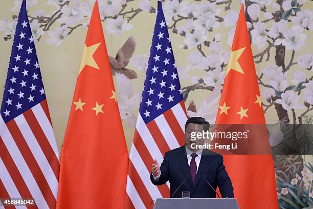 Chinese President Xi Jinping answers media's question during a press conference with U.S. President Barack Obama at the Great Hall of People on...