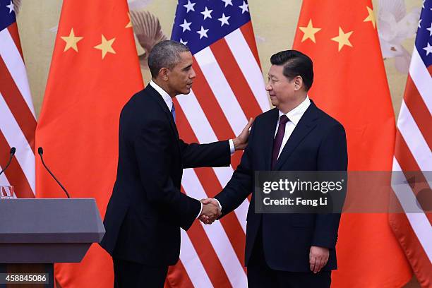 President Barack Obama shakes hands with Chinese President Xi Jinping after a joint press conference at the Great Hall of People on November 12, 2014...