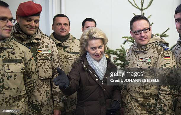 German Defence Minister Ursula von der Leyen poses for a photograph with German soldiers at Camp Marmal in Mazar-e-Sharif on December 22, 2013. Von...