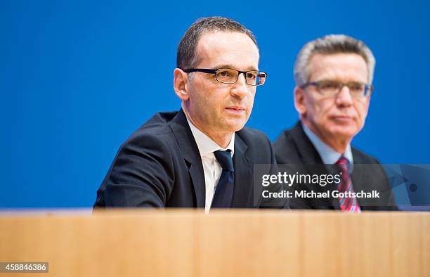 German Interior Minister Thomas de Maiziere and German Justice Minister Heiko Maas attends the presentation of a draft bill to doping regulations in...