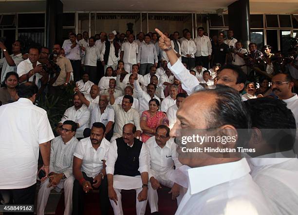 Congress legislators including former chief minister Prithviraj Chavan sit on stairs of Vidhan Sabha as they try to block the entry of Governor...