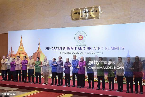 President Barack Obama takes part in the East Asia Summit family photo with other regional leaders at the Myanmar International Convention Center in...