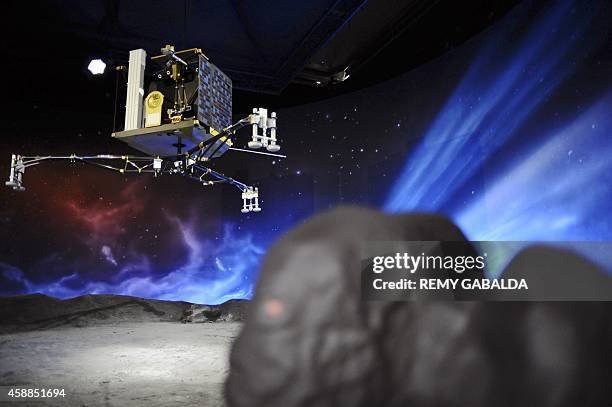 Picture shows a model of the European Space Agency's robot craft Philae at the Cite de l'espace in Toulouse, southern France, on November 12 the day...