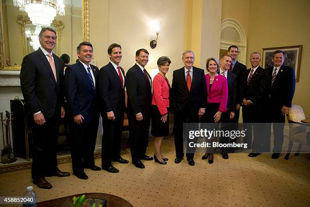 Senate Minority Leader Mitch McConnell, a Republican from Kentucky, center, stands with new Republican Senators-elect in his office including...