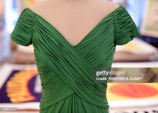 A detailed view of one of four dresses that belonged to Her Royal Highness, Diana, Princess of Wales is displayed during a one day media preview at...