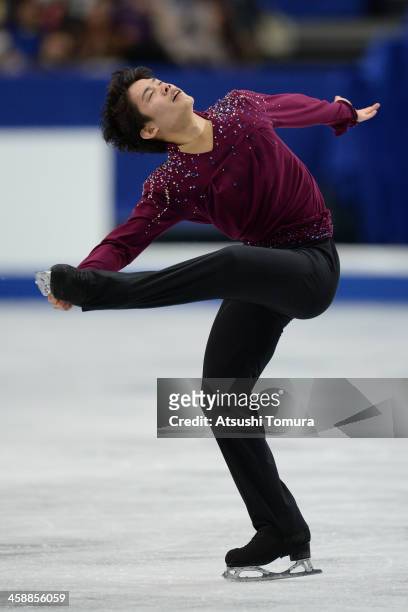 Takahiko Kozuka of Japan performs in the men's free skating during All Japan Figure Skating Championships at Saitama Super Arena on December 22, 2013...