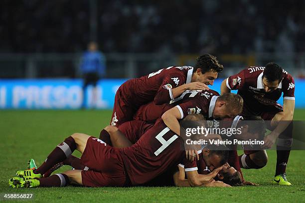 Alessio Cerci of Torino FC celebrates his goal with team-mates during the Serie A match between Torino FC and AC Chievo Verona at Stadio Olimpico di...