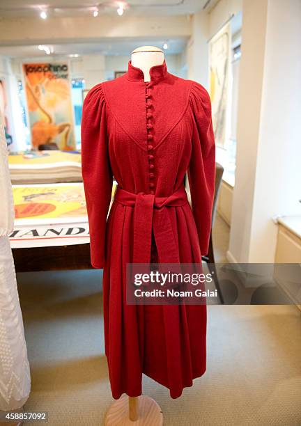 Burgundy wool coat dress designed by Caroline Charles and worn by HRH Princess Diana in 1982 while visiting the Milan Asian Community Playgroup in...