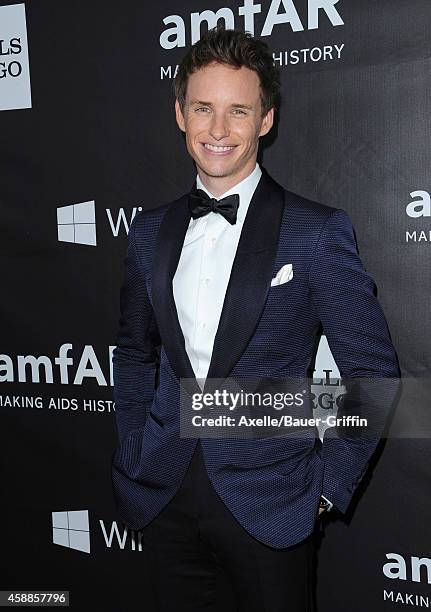 Actor Eddie Redmayne arrives at the 2014 amfAR LA Inspiration Gala at Milk Studios on October 29, 2014 in Hollywood, California.