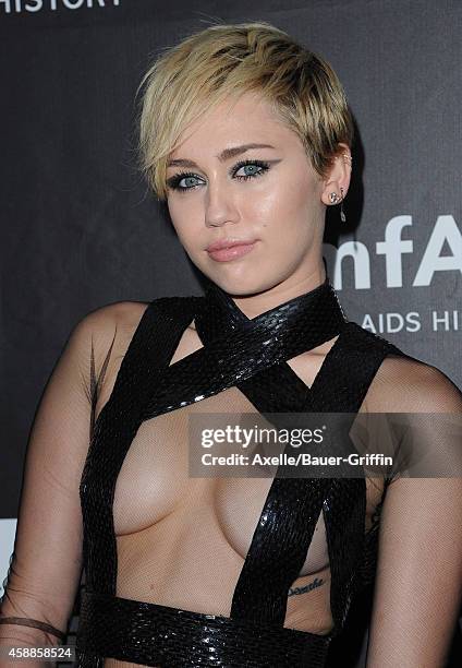 Singer Miley Cyrus arrives at the 2014 amfAR LA Inspiration Gala at Milk Studios on October 29, 2014 in Hollywood, California.