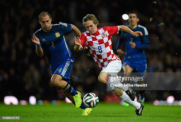 Alen Halilovic of Croatia is challenged by Pablo Zabaleta of Argentina during an International Friendly between Argentina and Croatia at Boleyn...