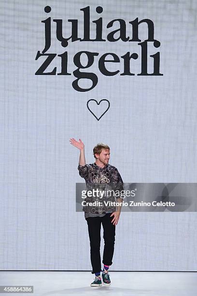 Designer Julian Zigerli walks the runway at the Julian Zigerli show during the Mercedes-Benz Fashion Days Zurich 2014 on November 12, 2014 in Zurich,...