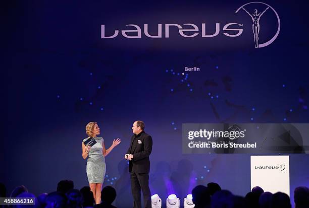 Presenter Wolfram Kons and Kathi Woerndl , Austrian TV presenter attend the Laureus Media Award 2014 at Grand Hyatt Hotel on November 12, 2014 in...