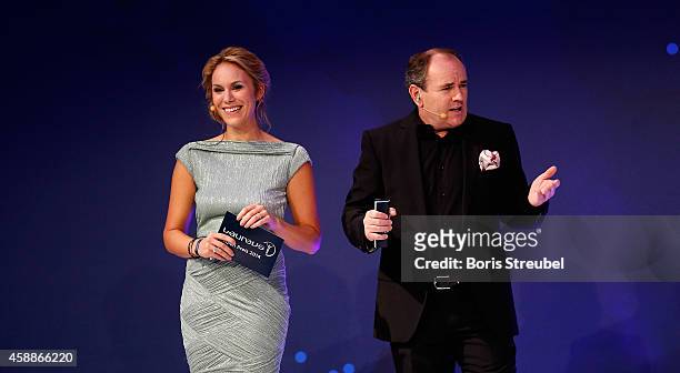 Presenter Wolfram Kons and Kathi Woerndl , Austrian TV presenter attend the Laureus Media Award 2014 at Grand Hyatt Hotel on November 12, 2014 in...